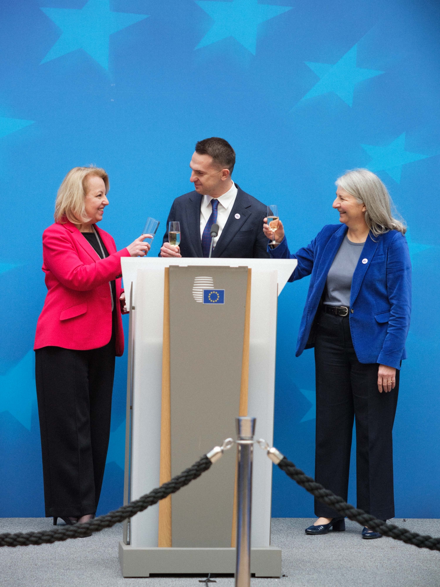 Minister Adam Szłapka with Therese Blanchet at press conference rising a toast