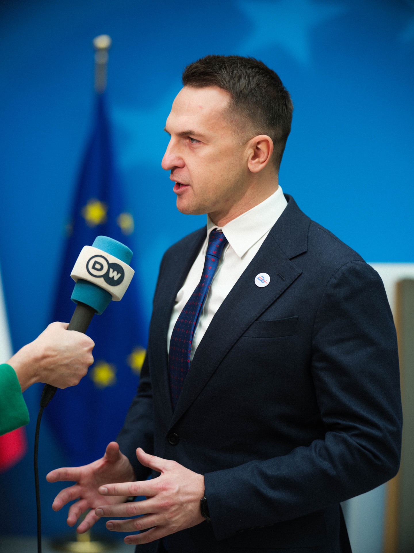 Minister Adam Szłapka being interviewed