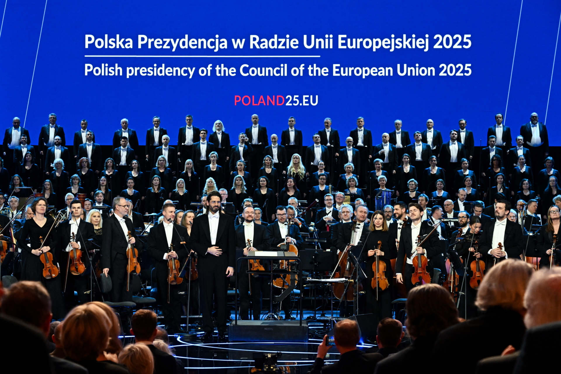 a choir and the artists on stage