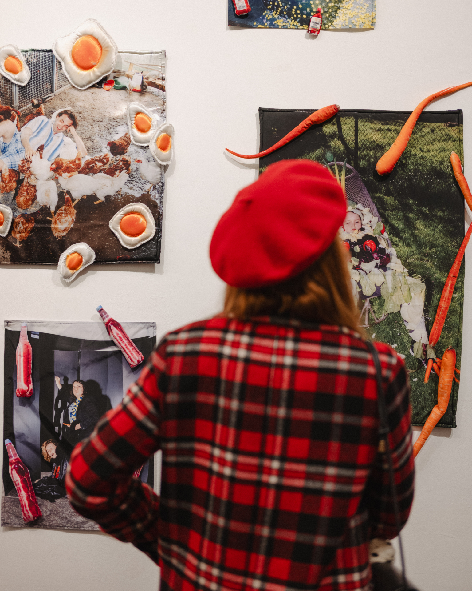A person watching exhubited photos and items