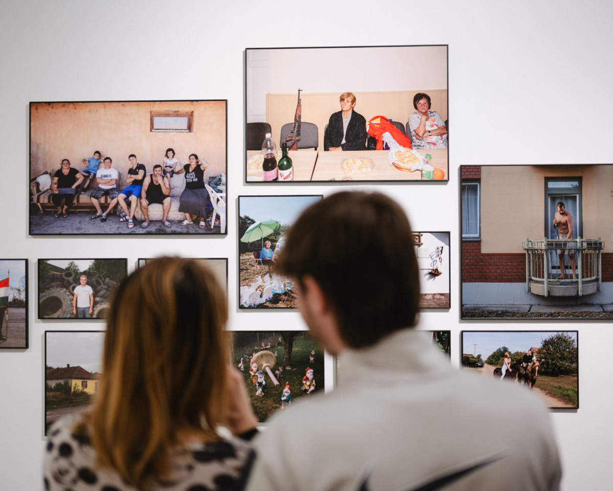 A person watching exhubited photos and items