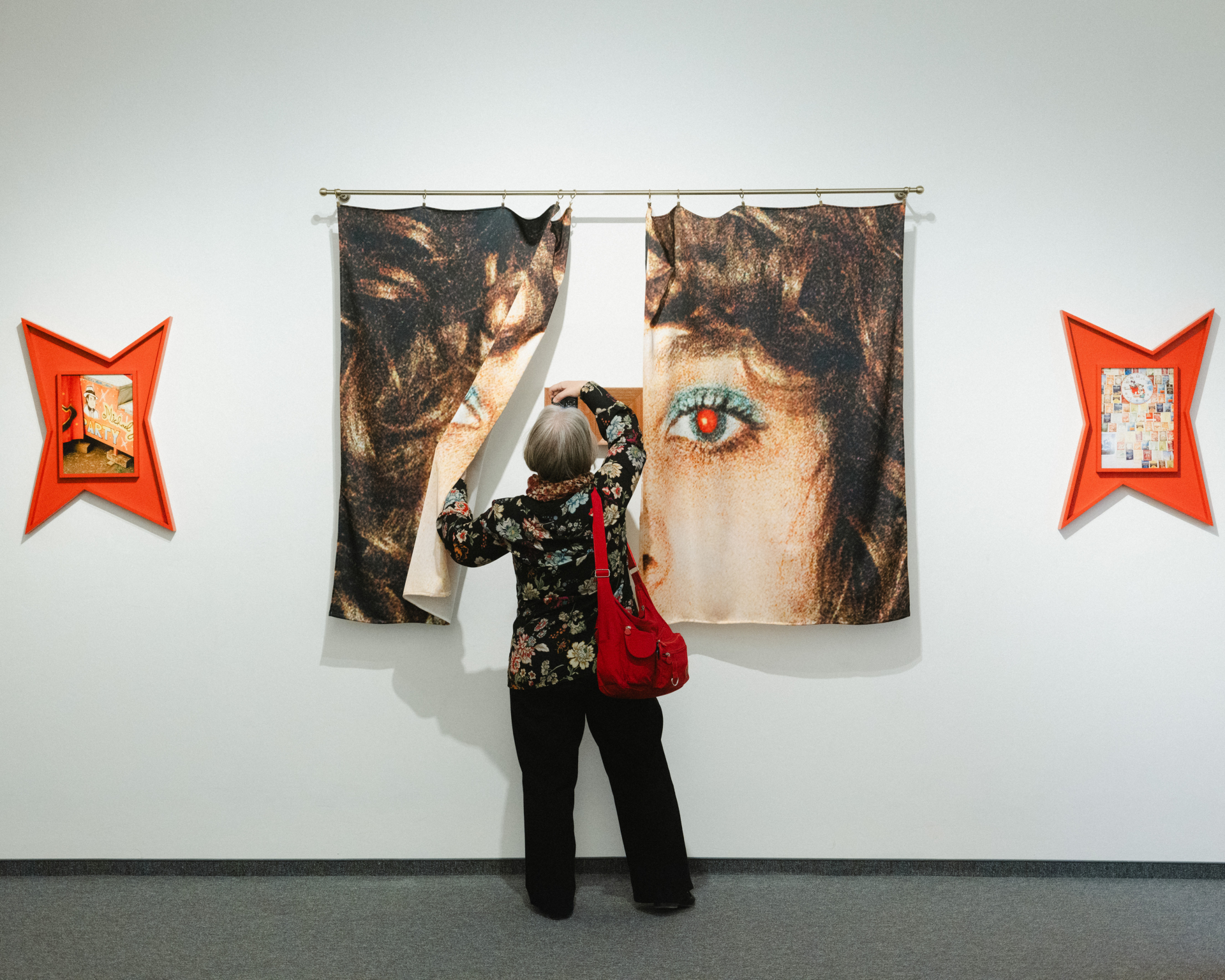 A person watching exhubited photos and items