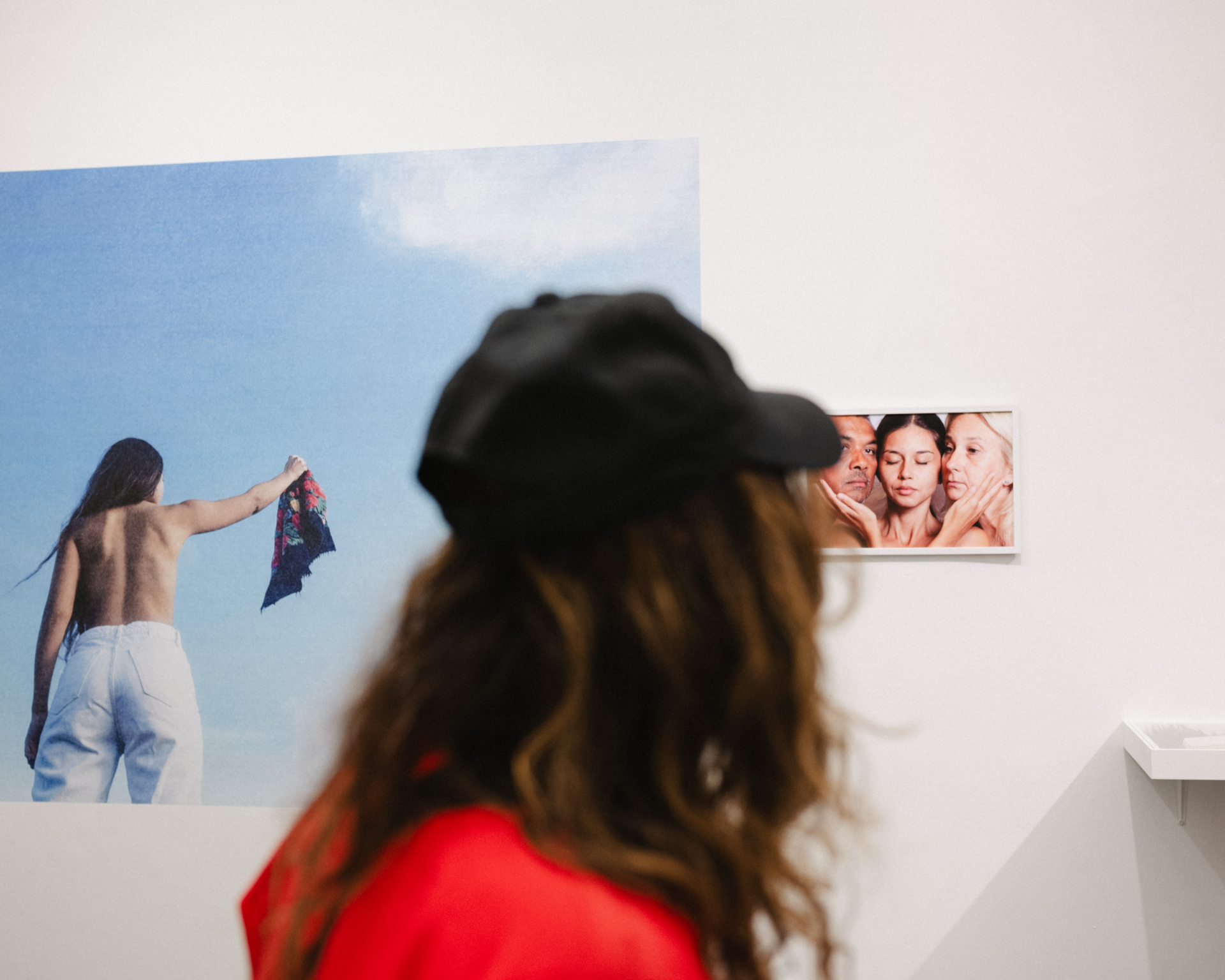 A person watching exhubited photos and items