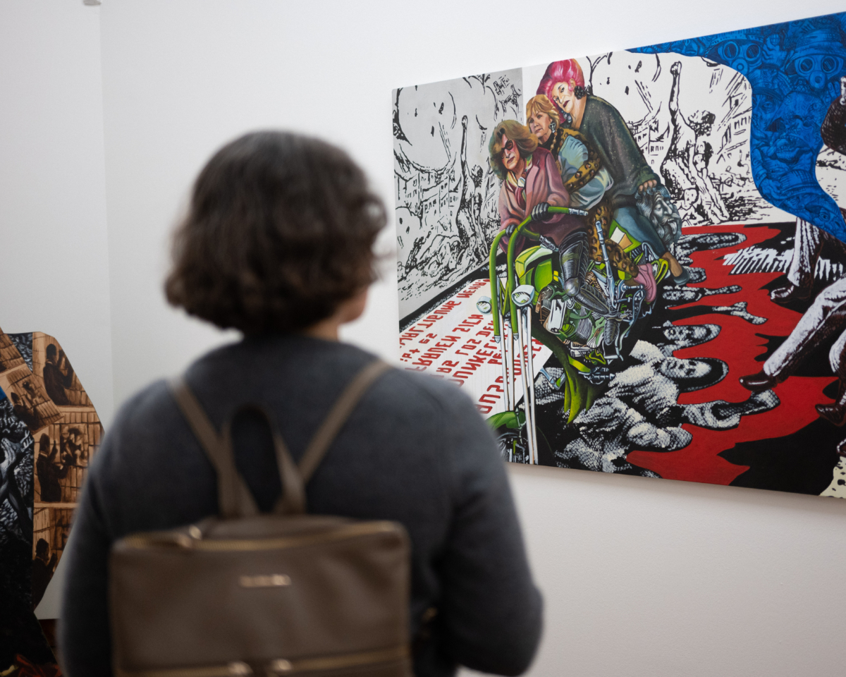a visitor admiring a piece of art from the